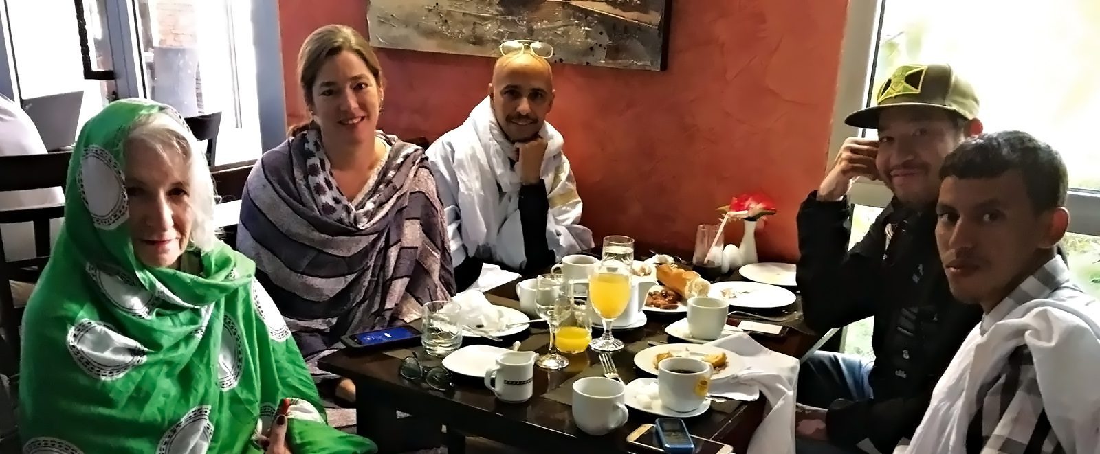 fierce-banner fierce defenders article subjects sitting around a breakfast table smiling at camera
