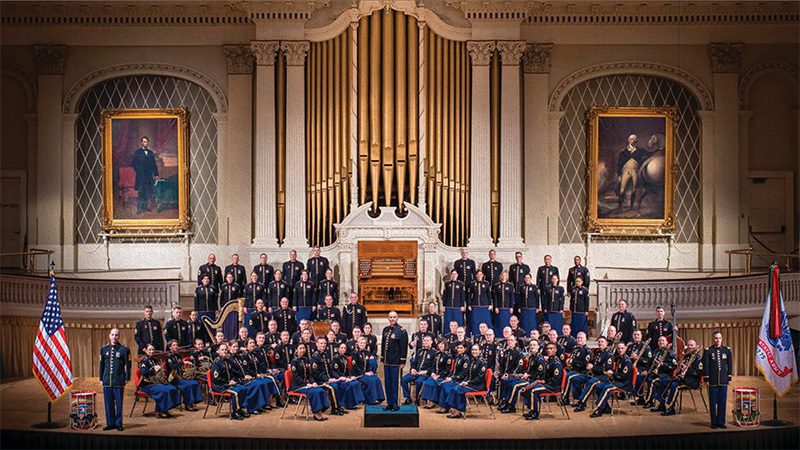 army-band group portrait of large army band in patriotic setting