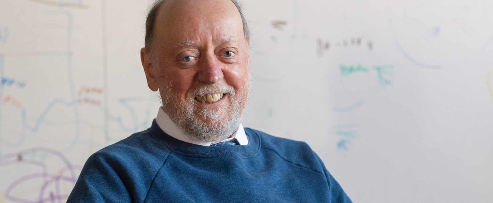 Jack Dongarra smiling with whiteboard in background