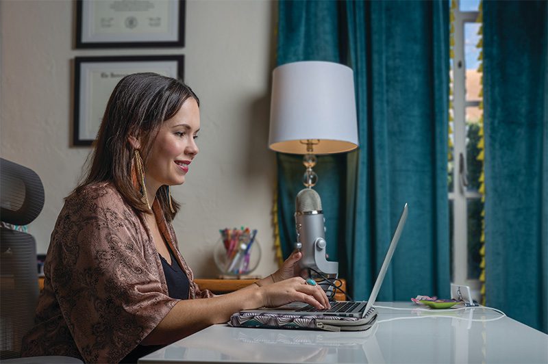 Ingela Onstad working on her laptop