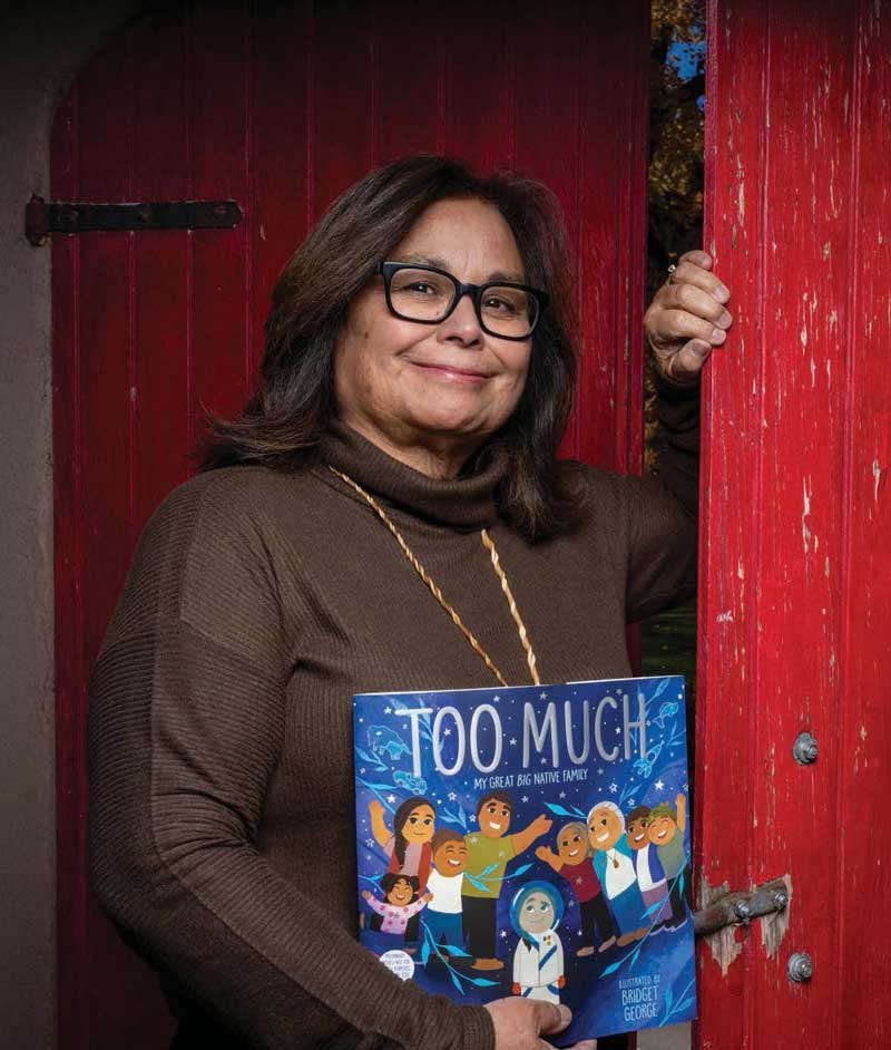 Photo of Laurel Goodluck holding one of her children's books.