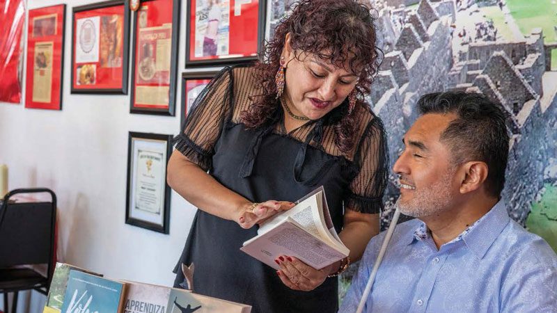 Carlos Servan, with sister Monica, at a book signing in Albuquerque.